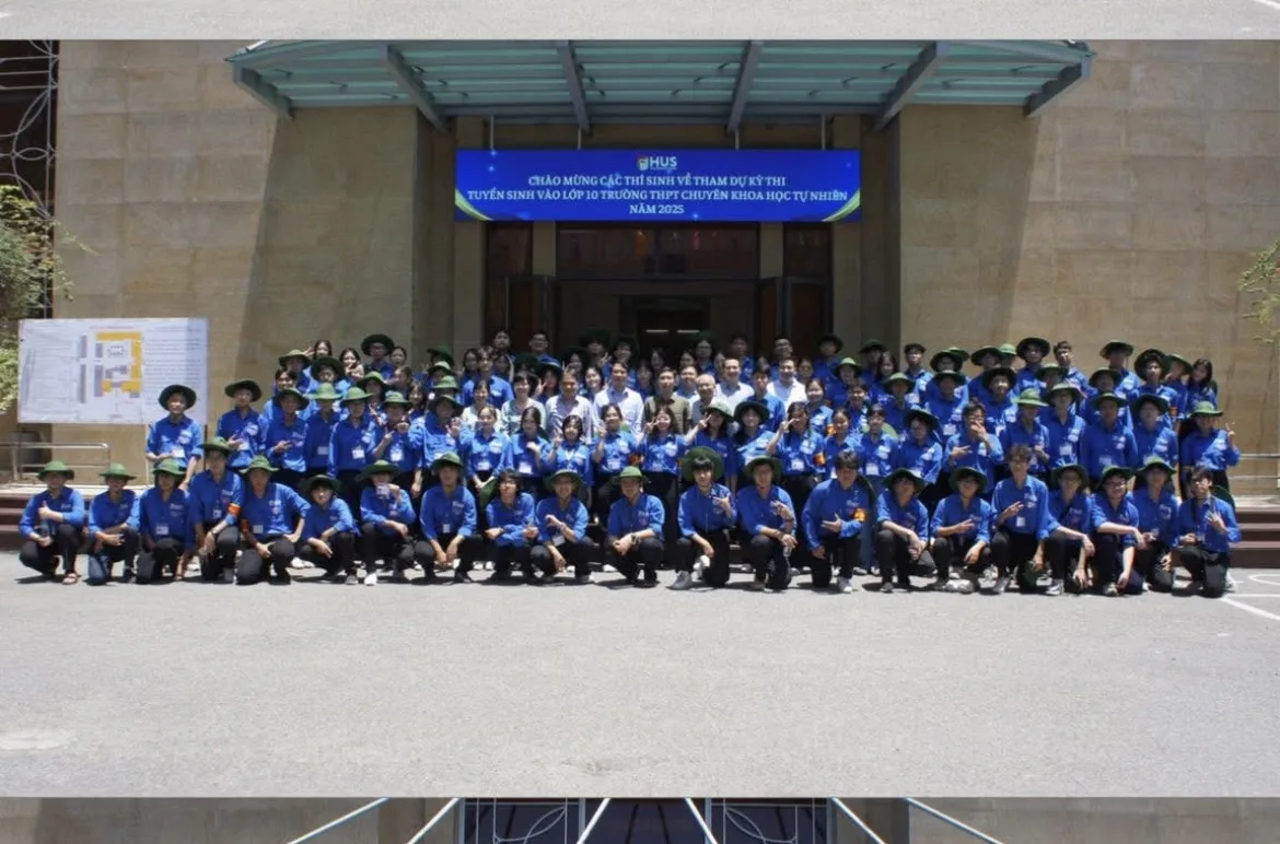 A large group of volunteers in blue shirts outside HUS High School for Gifted Students